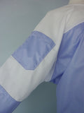 barrier lab gown with mesh sleeve close up